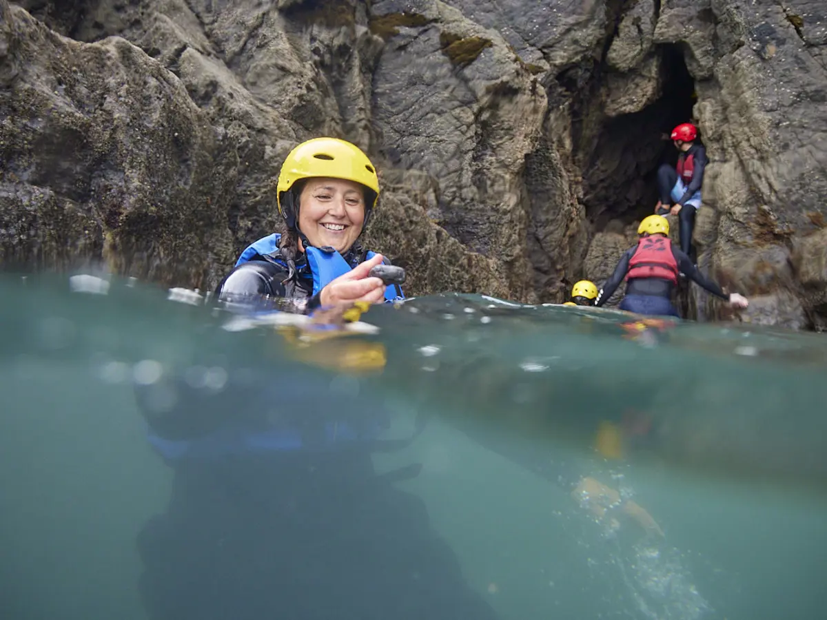 Women surfing during a retreat in Pembrokeshire Wales