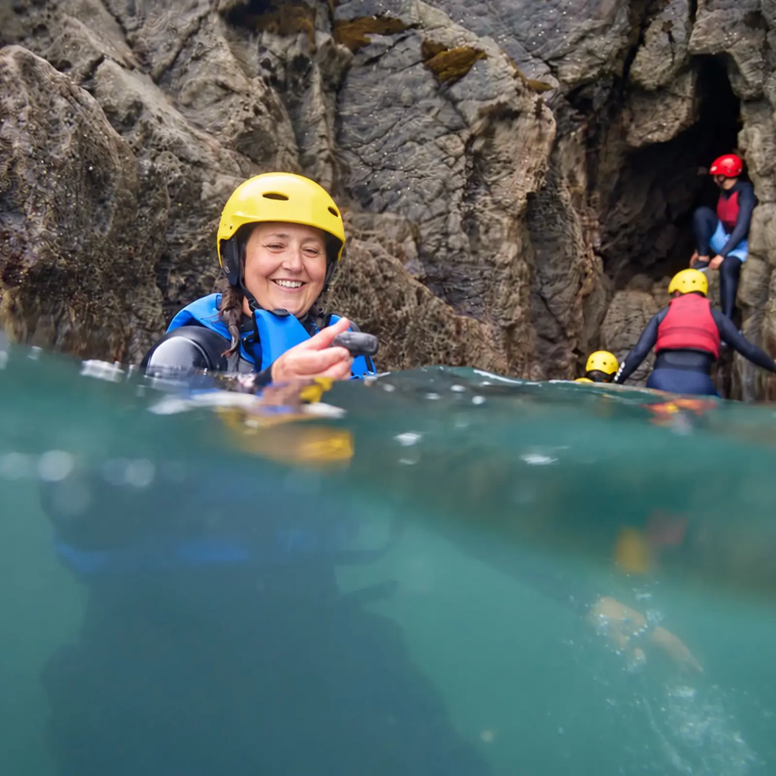 Exploring sea caves during a guided coasteering experience