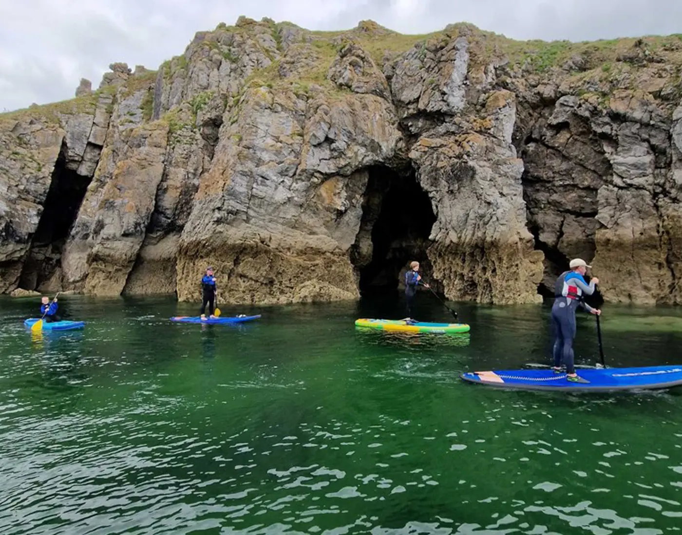 Family paddle boarding activity in Tenby and Pembrokeshire
