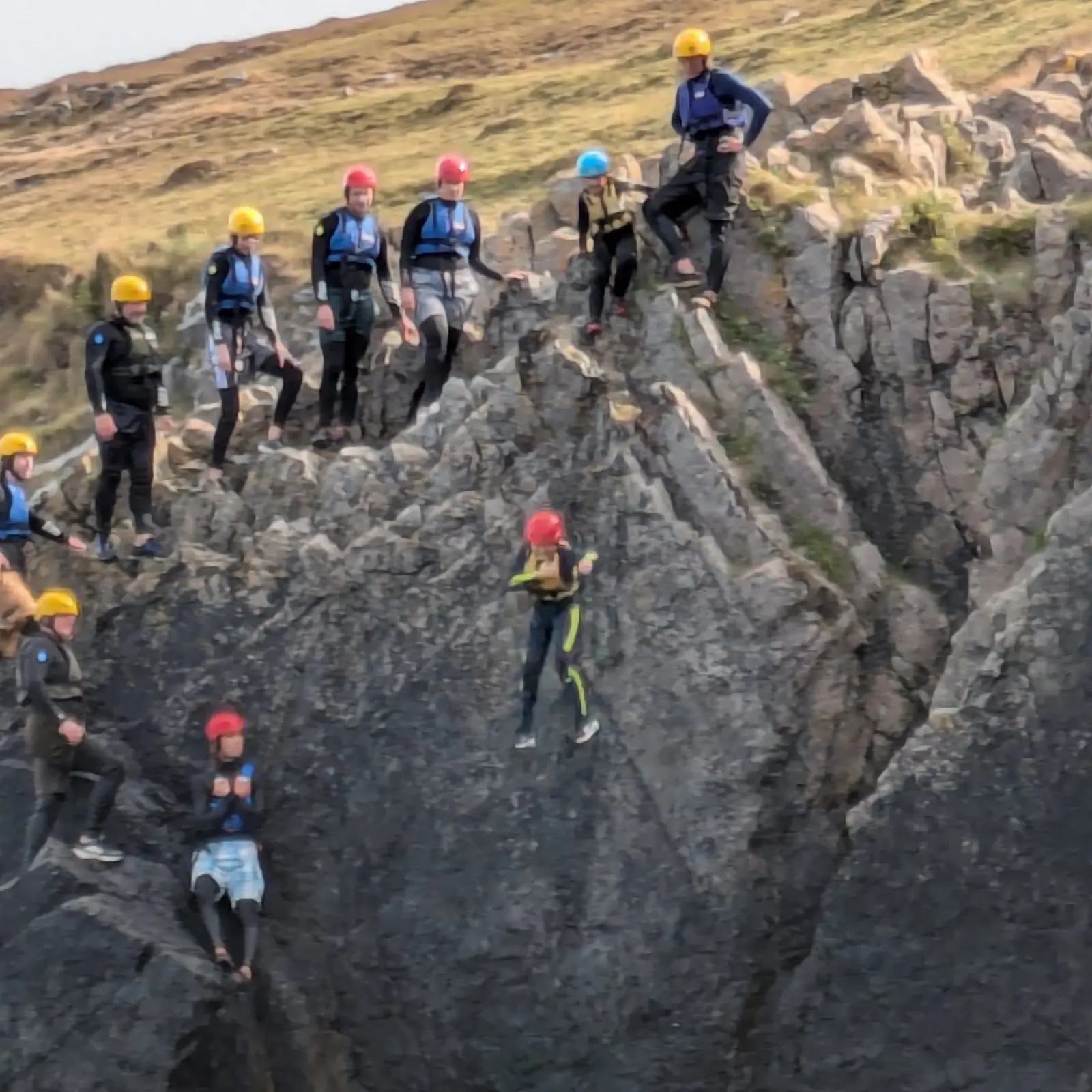 Coasteering adventure group exploring the Pembrokeshire coastline
