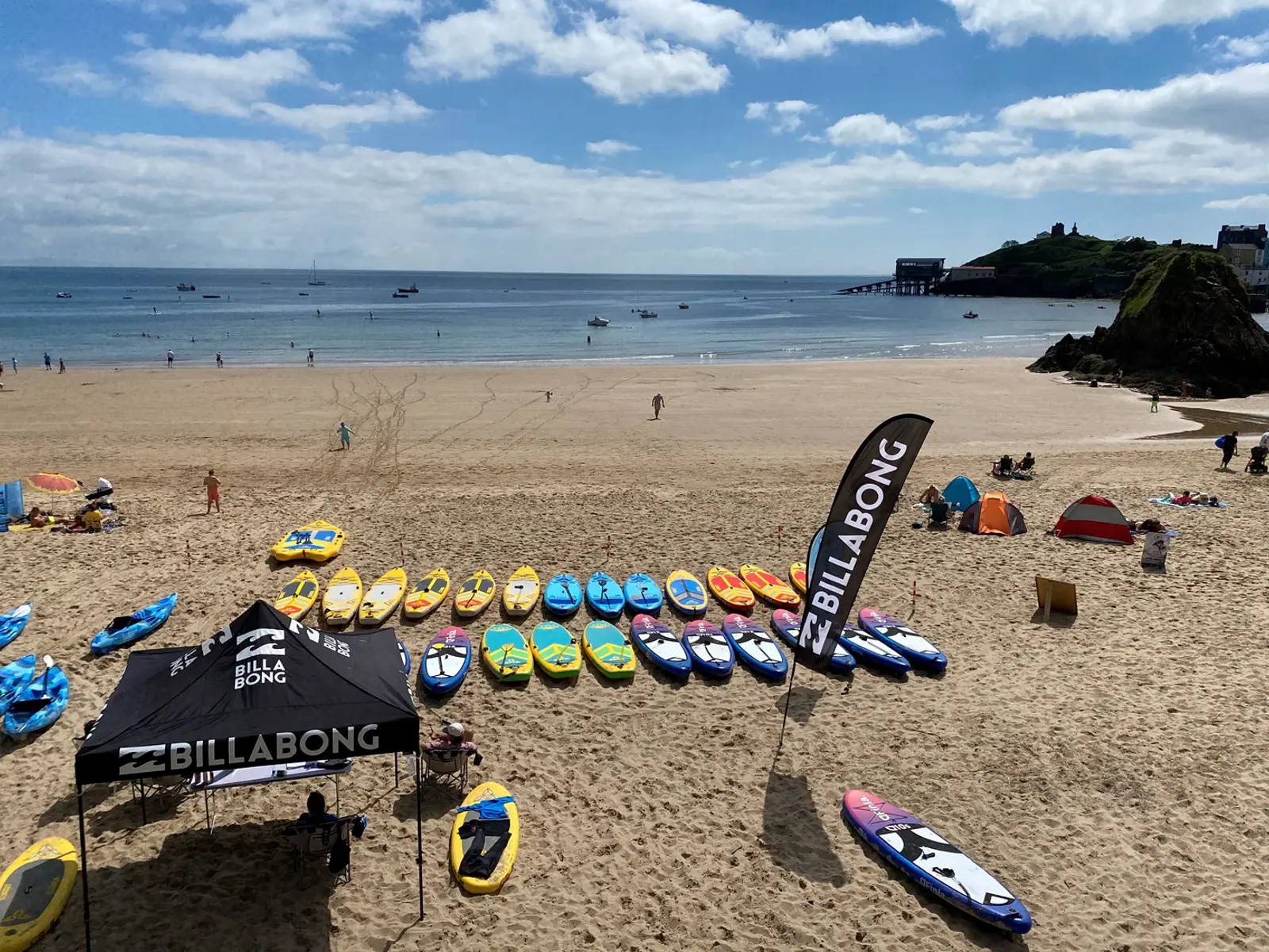 Tenby coastal adventure guide with surfing paddleboarding kayaking and coasteering in Pembrokeshire