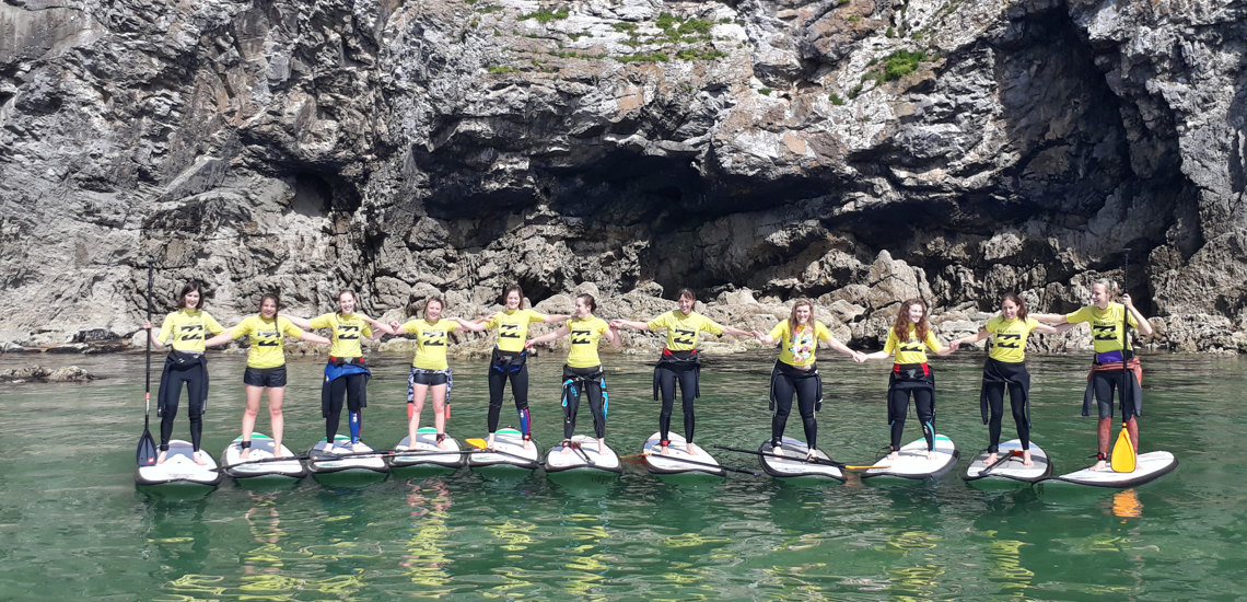 Paddle boarding and surfing at Broad Haven