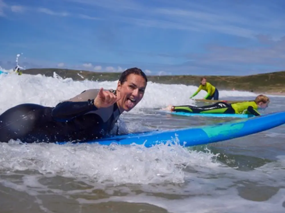 Women learning to surf on a Pembrokeshire retreat