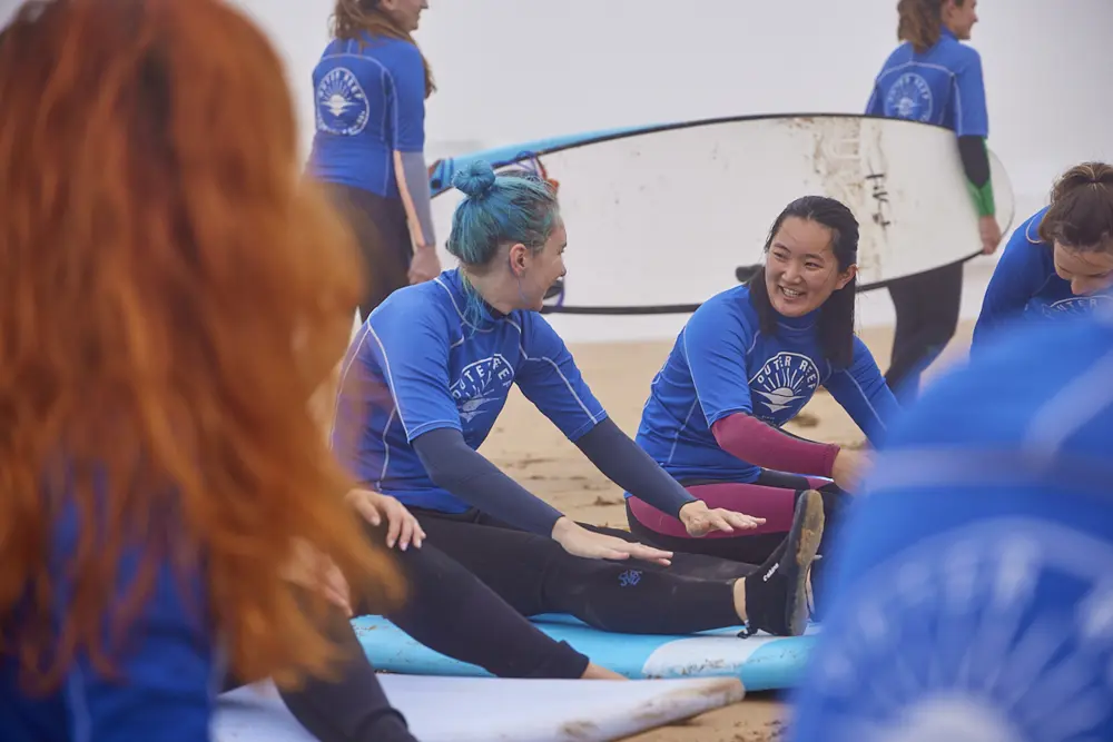 Women learning to surf with Outer Reef