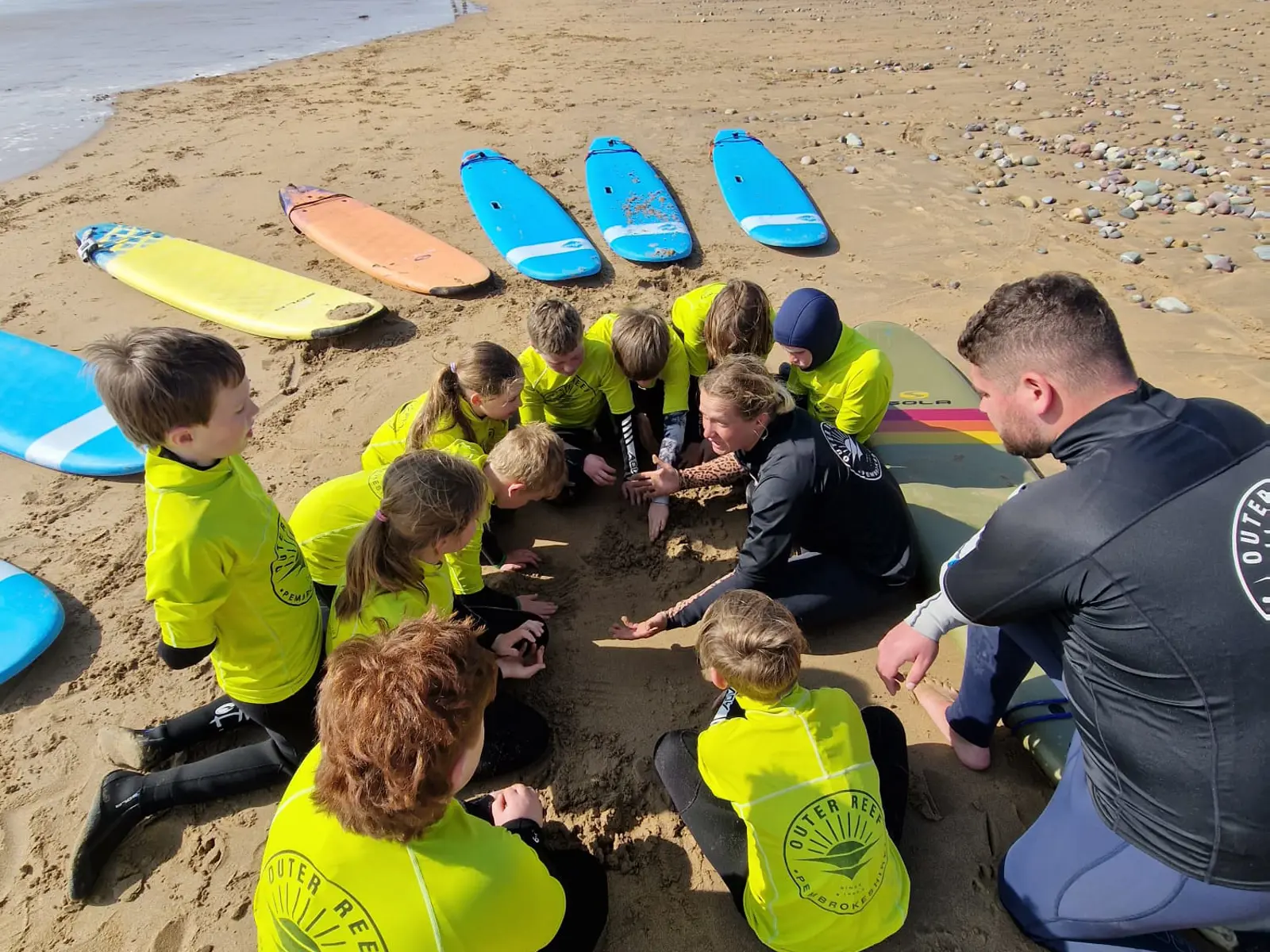 Children learning surf safety in Pembrokeshire