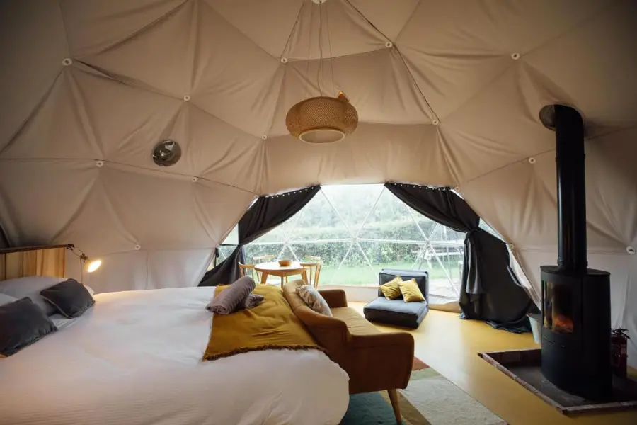 Comfortable glamping dome bedroom