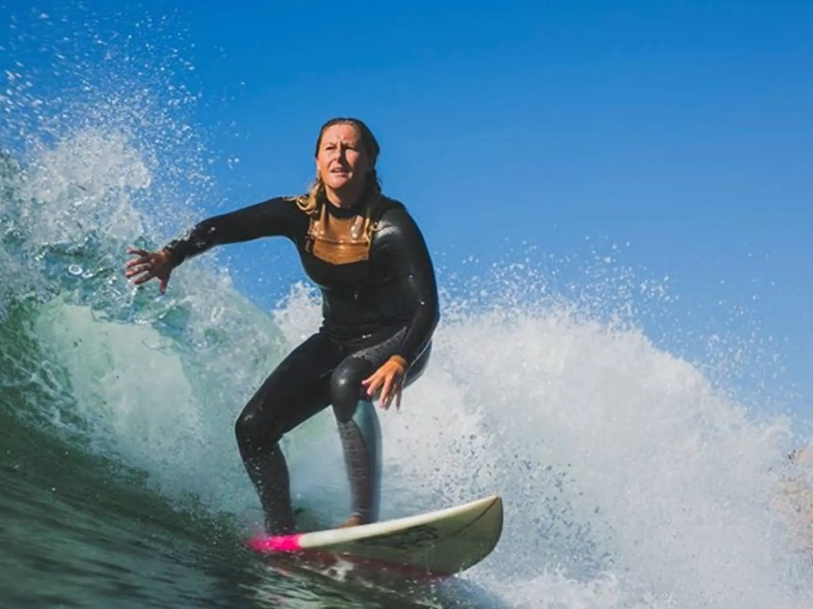 Women surfing with Salty Sisters in Pembrokeshire Wales