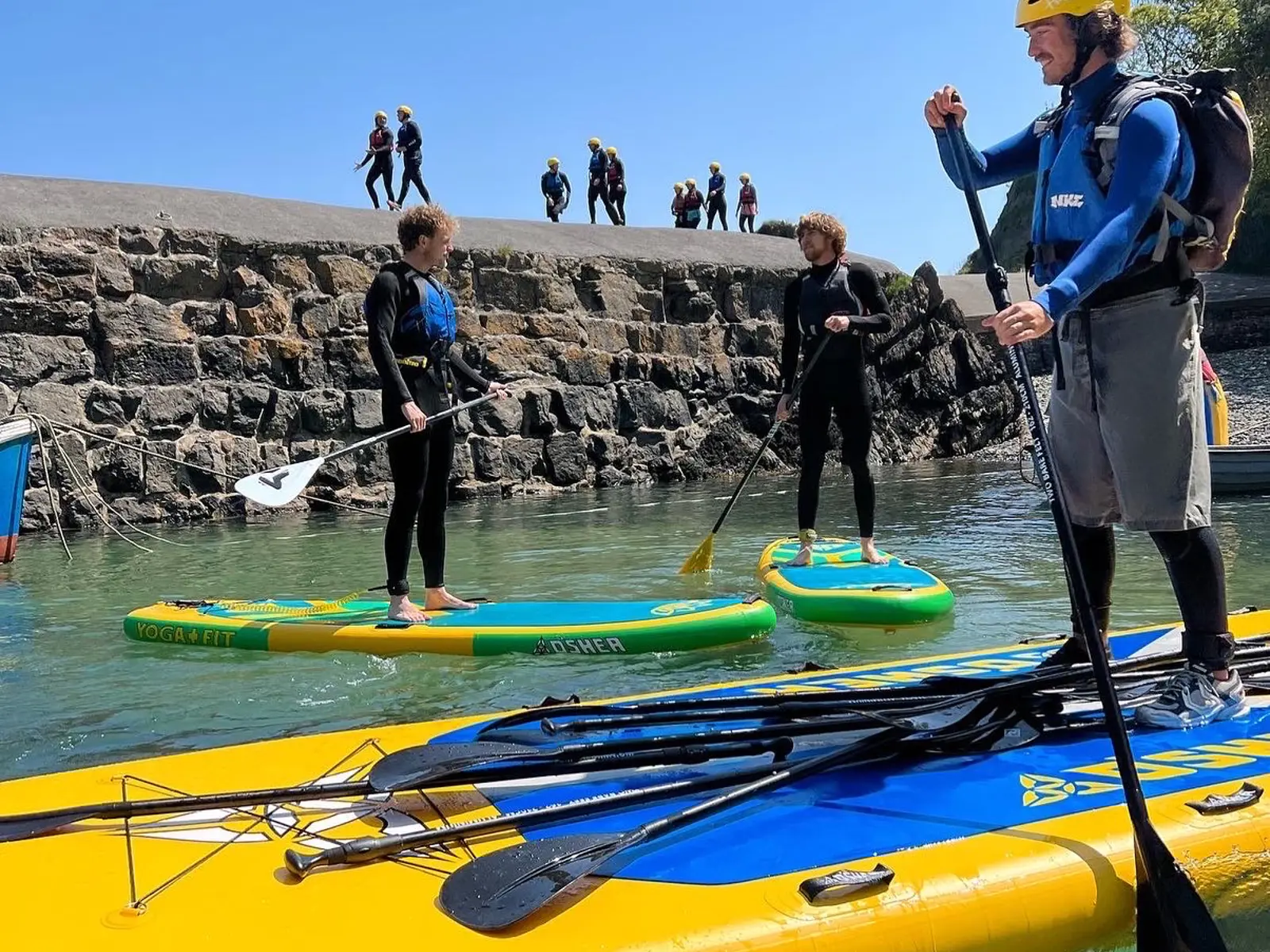 Group paddle boarding activity in Pembrokeshire